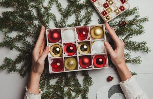 Christmas decoration from above overhead with woman hands